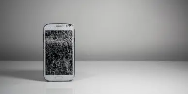 A white phone sitting on top of a table.